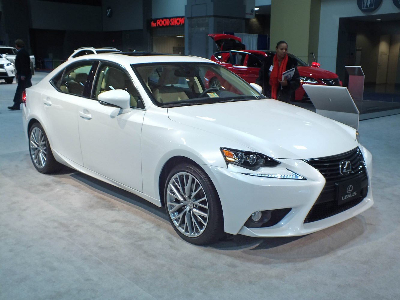 White luxury sedan with distinctive front grille and LED headlights