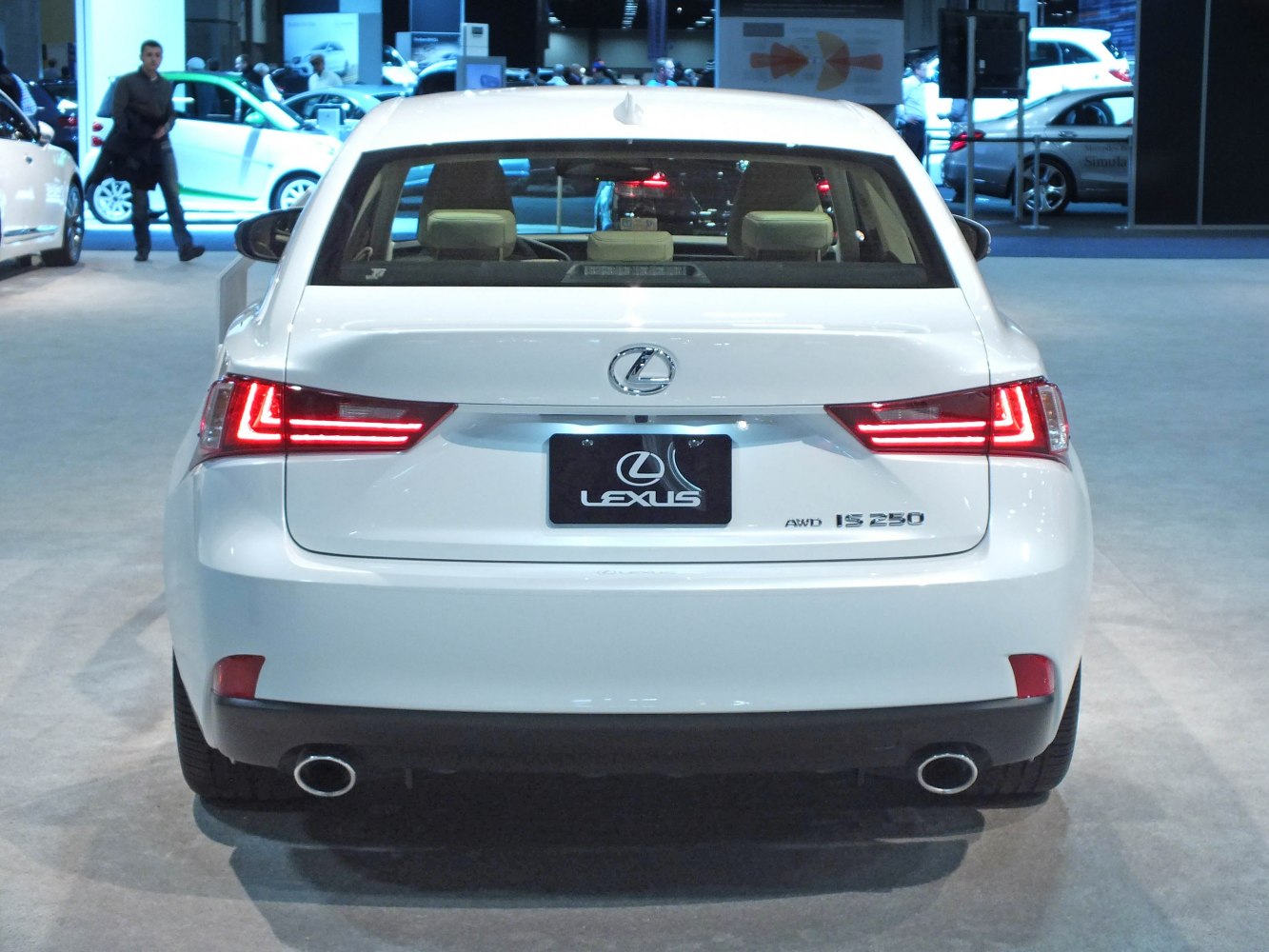 Rear view with LED taillights, AWD badge, and dual exhausts