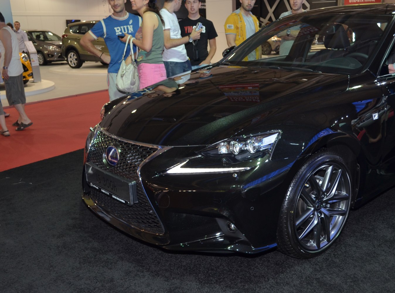 Front-end details showing headlight and alloy wheel design