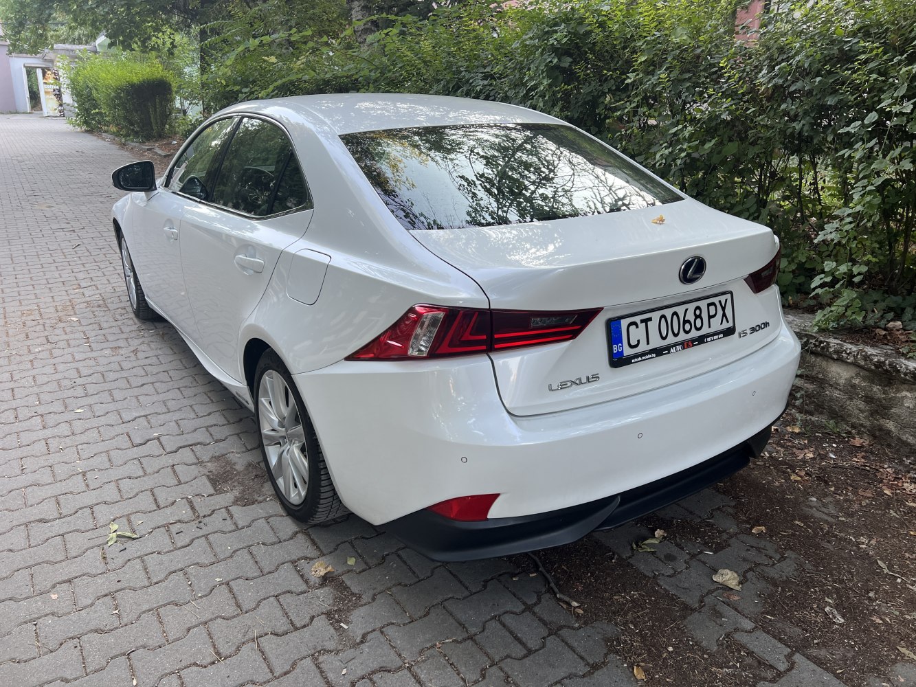 Rear and side view of a sedan with sharp taillights and smooth body lines