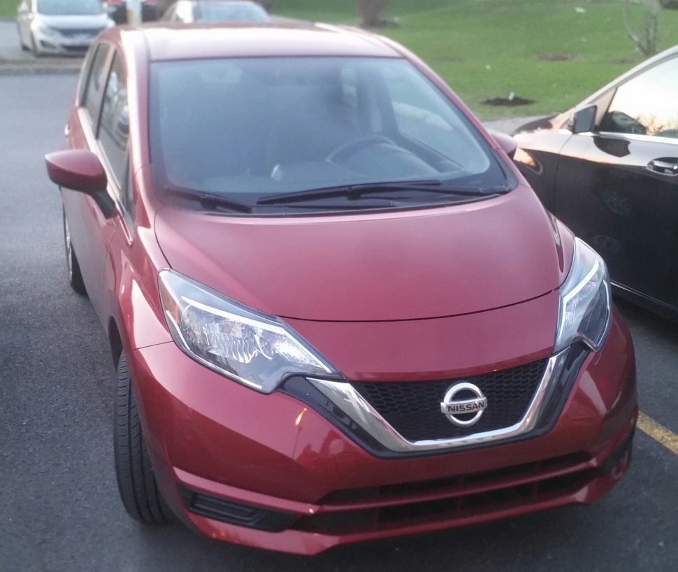 Front fascia with distinctive headlights and grille of a compact hatchback