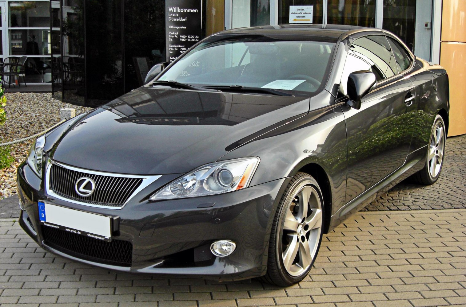 Front and side view of black coupe convertible with alloy wheels