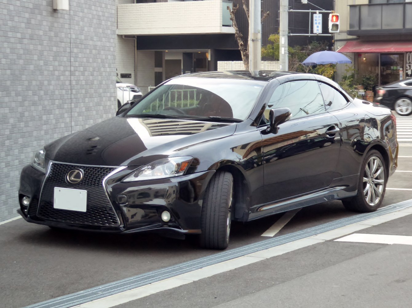 Black sporty coupe convertible with distinctive grille and sleek side profile