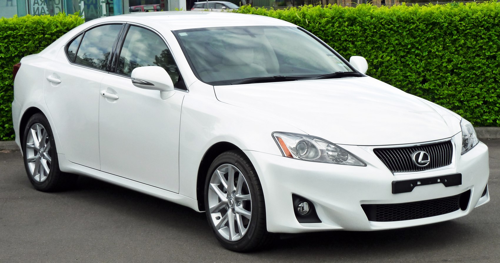 White sedan with sharp headlights and prominent grille