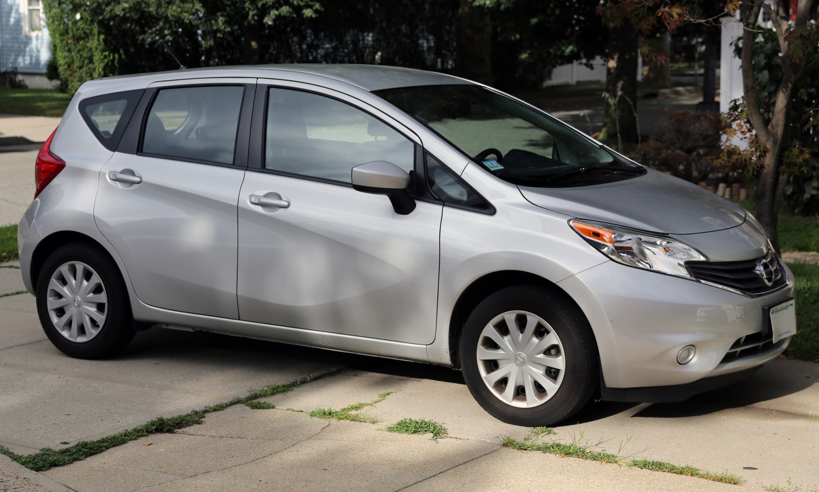 Silver four-door compact hatchback with smooth body contours