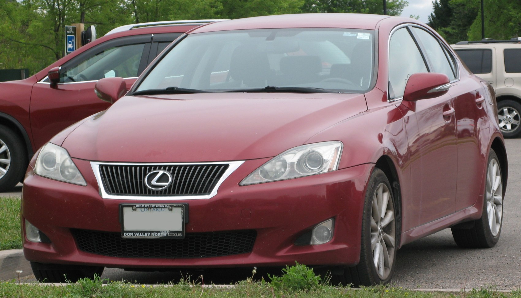 Front view featuring headlights and distinctive grille of a 2009 luxury sedan.