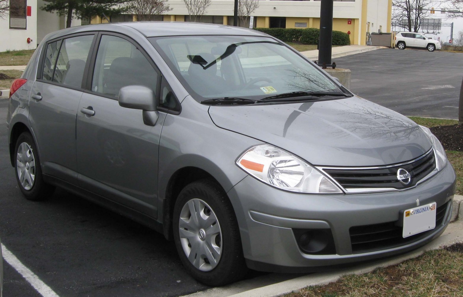 Front three-quarter view of a hatchback with headlights and grille