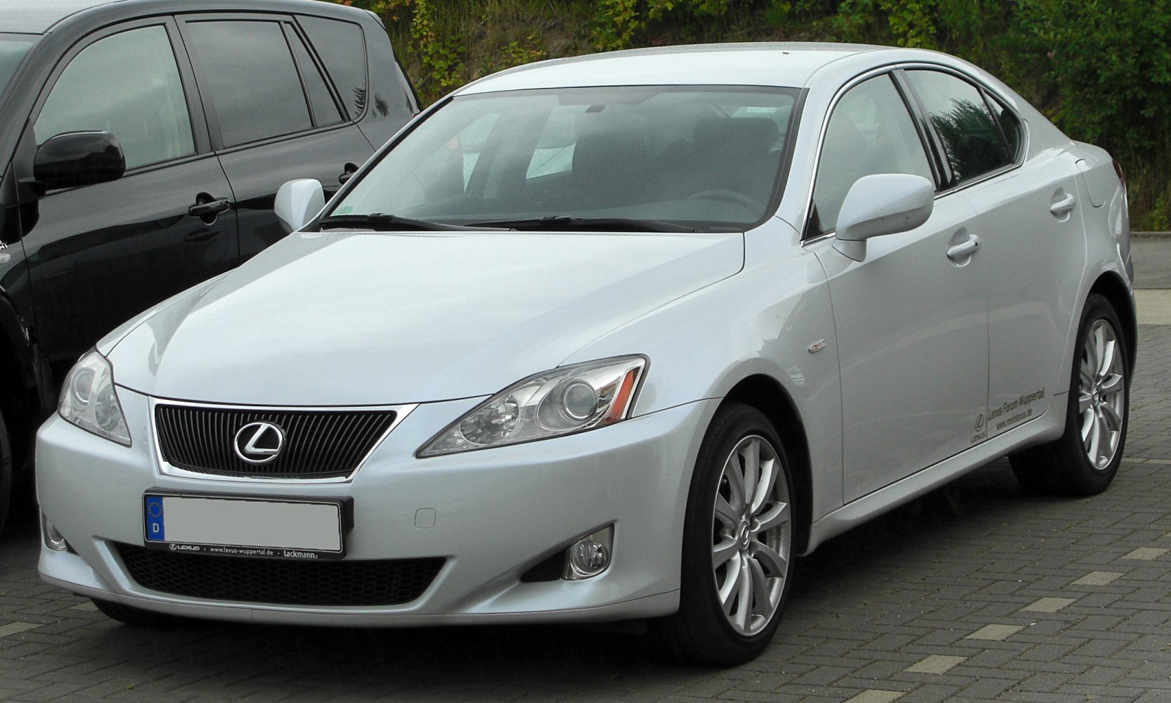 Silver luxury sedan with distinctive grille and sporty alloy wheels