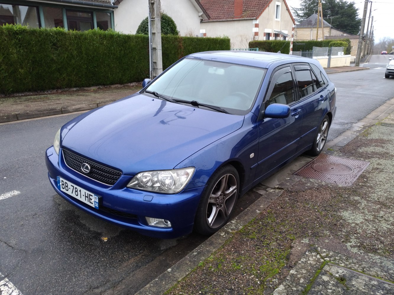 Blue five-door hatchback with alloy wheels and distinct front grille