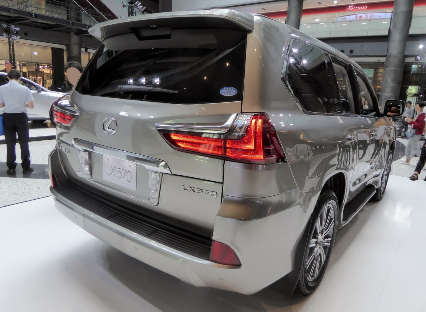 Rear view of luxury SUV with distinctive tail lights and chrome trim