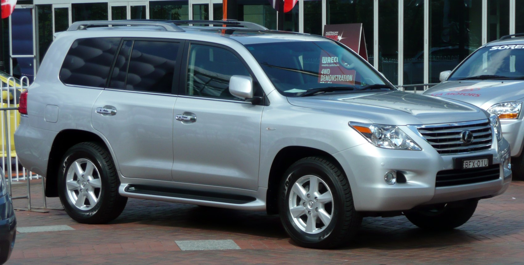 Silver SUV side profile with roof rails and alloy wheels