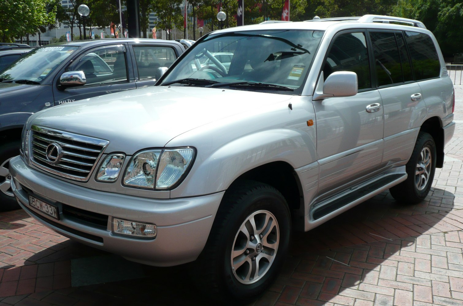 Silver SUV front side with chrome grille and alloy wheels