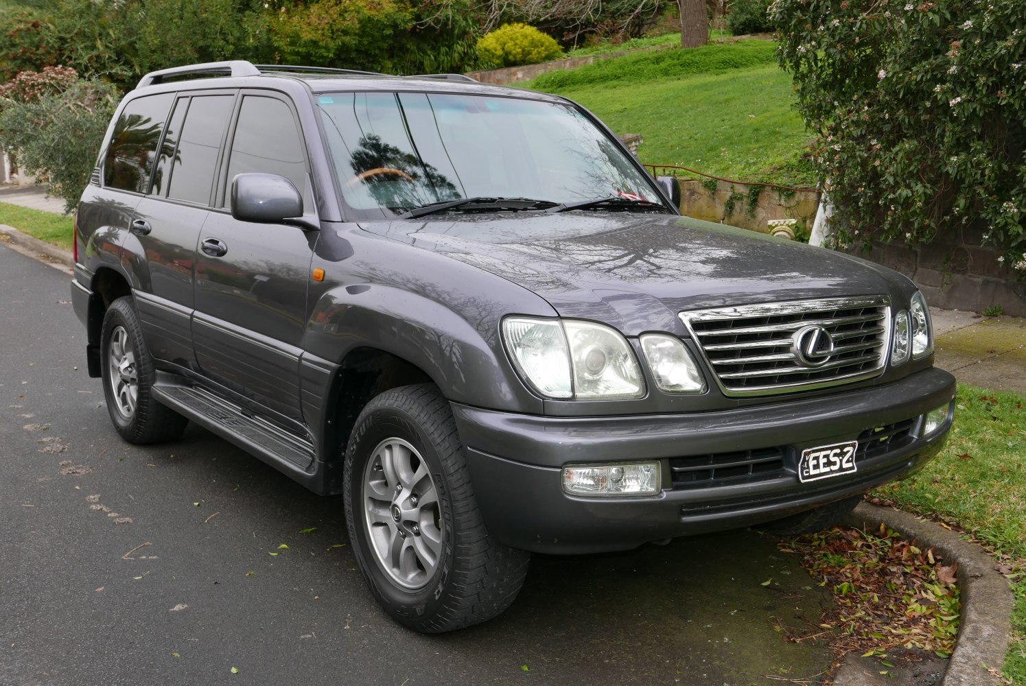 Front-side view of SUV with distinct grille and headlights