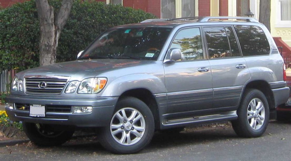 Front side view of a mid-2000s luxury SUV with distinct grille and alloy wheels