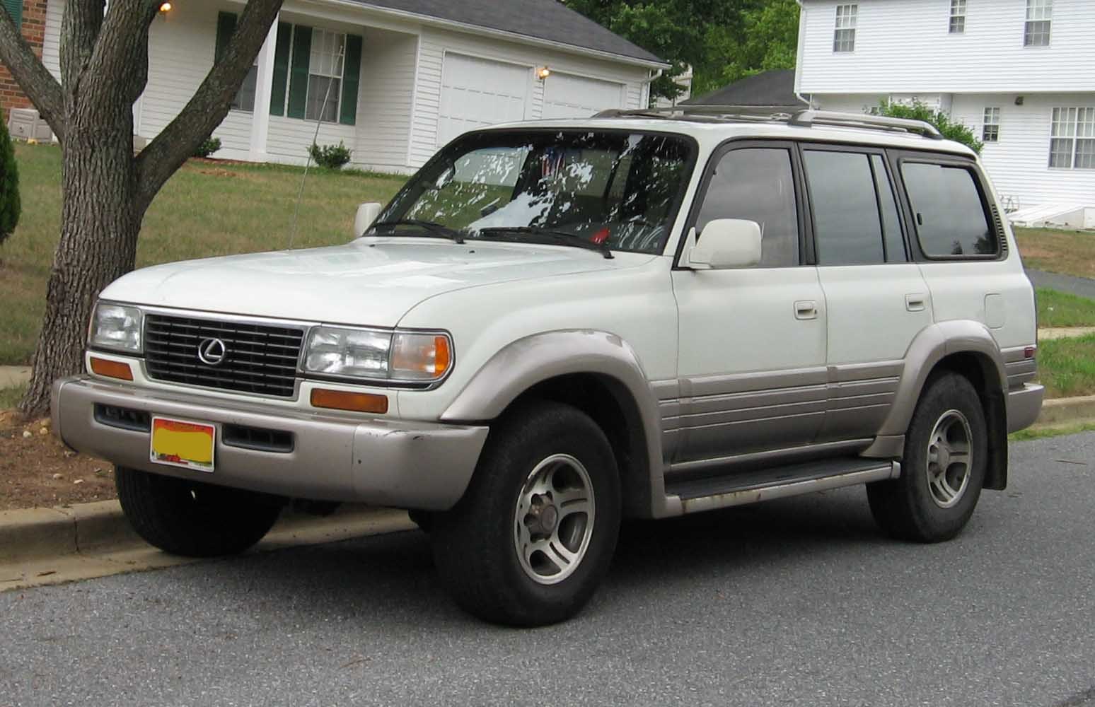 Front-side view of 1990s SUV with alloy wheels and smooth body design