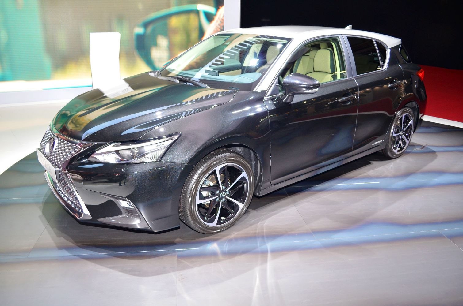 Front and side view with alloy wheels and sleek hatchback design