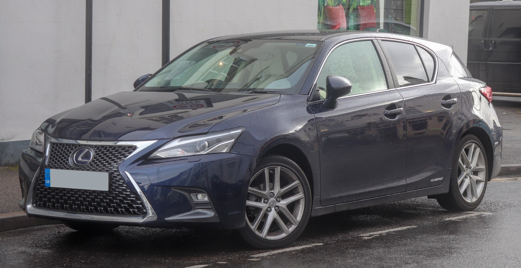 Front-side view of hybrid hatchback with spindle grille and alloy wheels