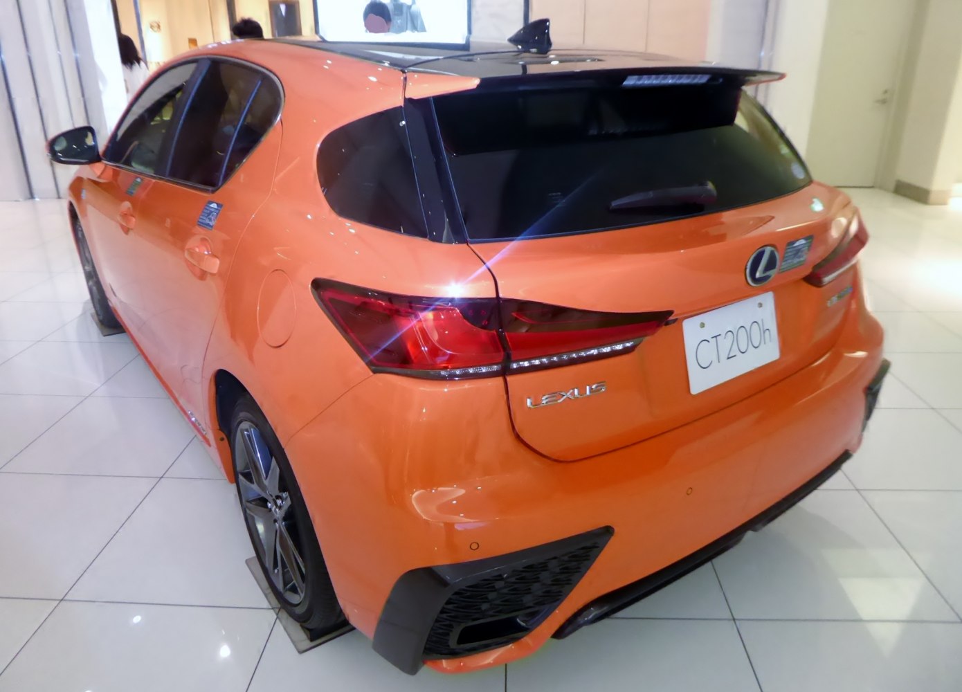 Rear view with slim LED taillights and spoiler