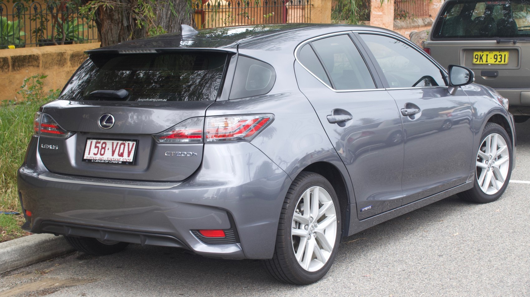 Rear and side view of hybrid hatchback with sleek taillights and alloy wheels