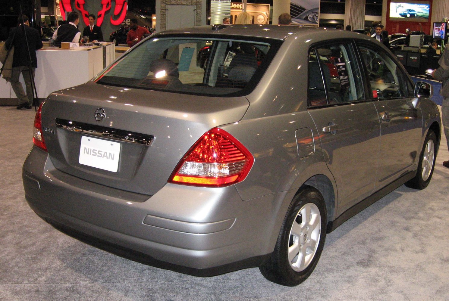 Rear and side view of a compact sedan with distinctive taillights