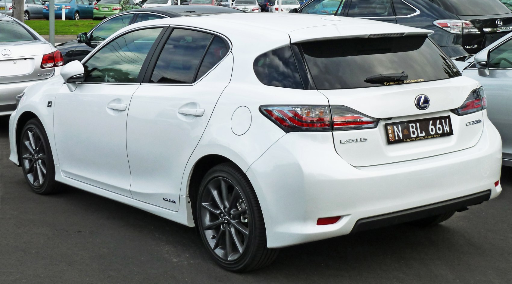 Hybrid hatchback rear and side view with distinct tail lights and alloy wheels