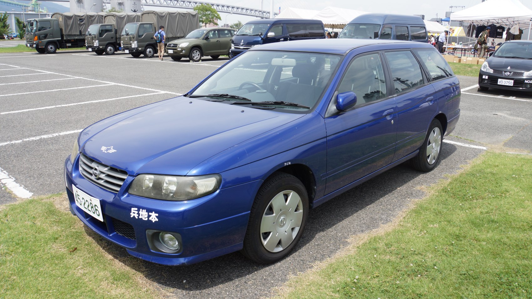 Blue station wagon with fog lights and alloy wheels