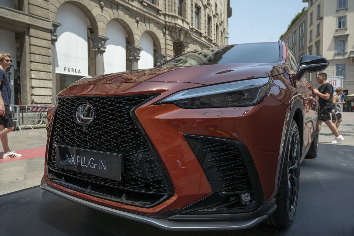 Close-up of front grille and sharp headlight design