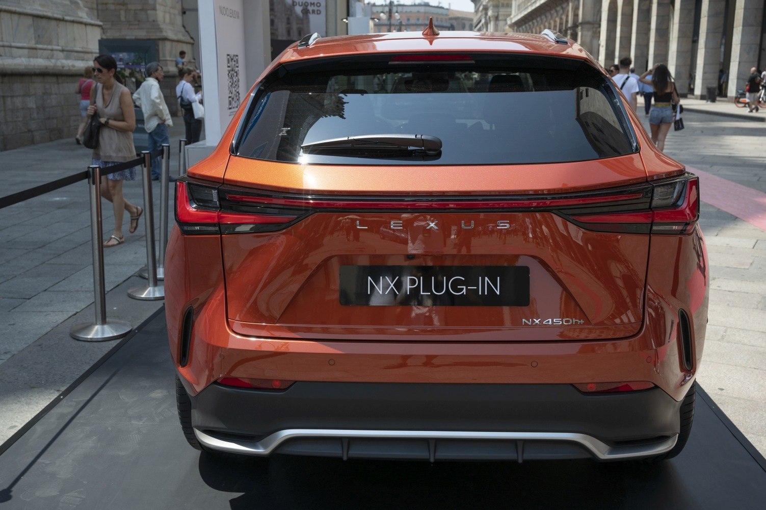 Rear view of modern SUV with connected tail lights and plug-in hybrid badge