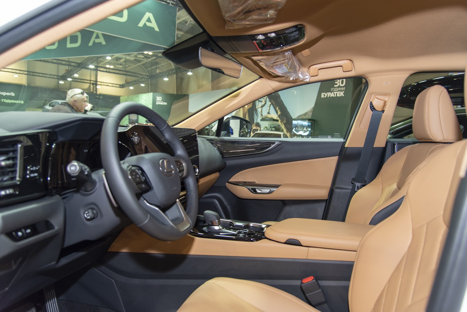 Luxurious tan leather interior with modern dashboard and cockpit design