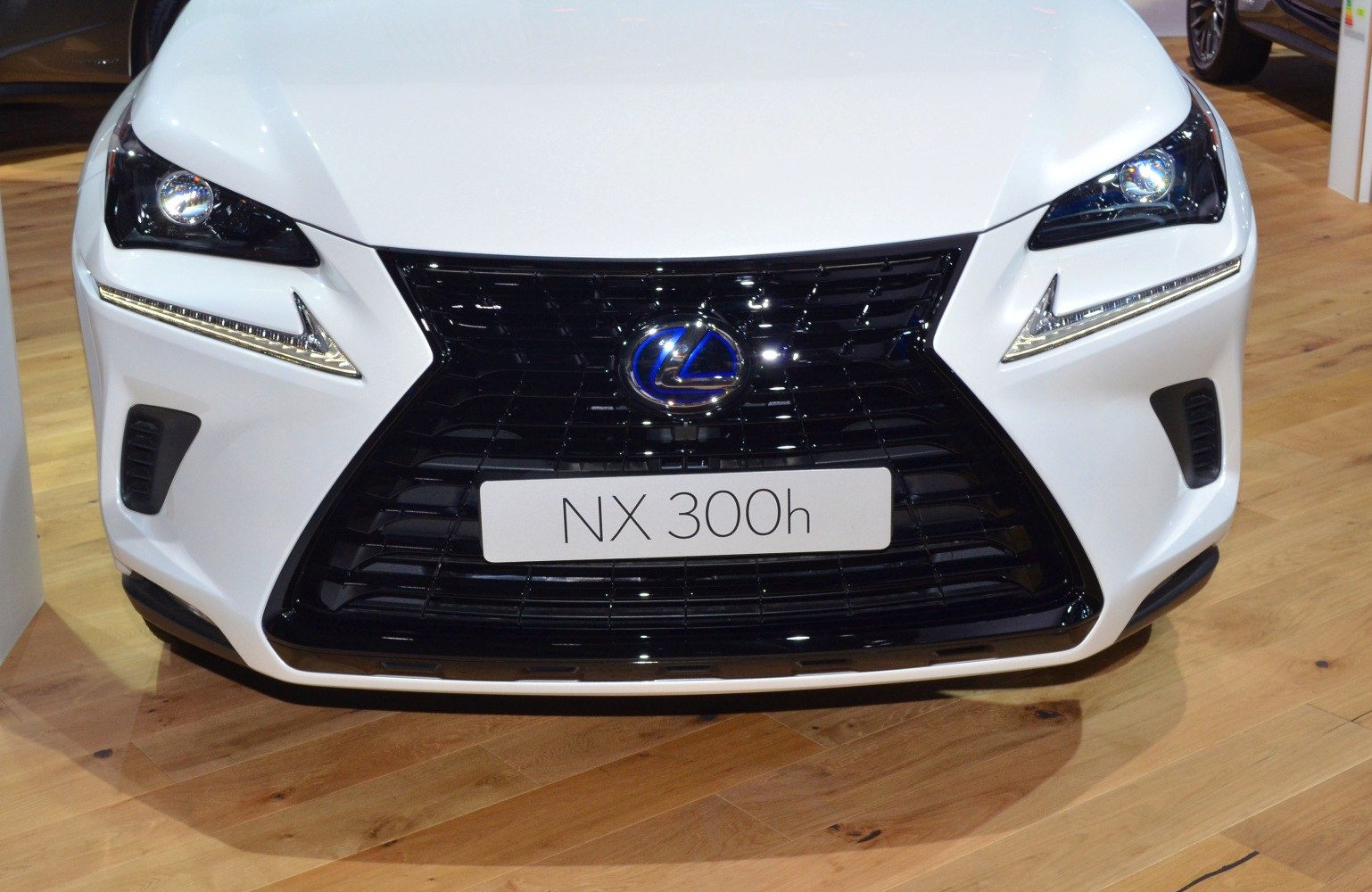 Detailed front grille and headlight design with integrated LED daytime running lights.