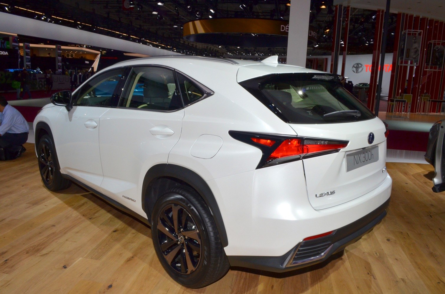 Rear and side profile of hybrid SUV with black wheels and angular taillights