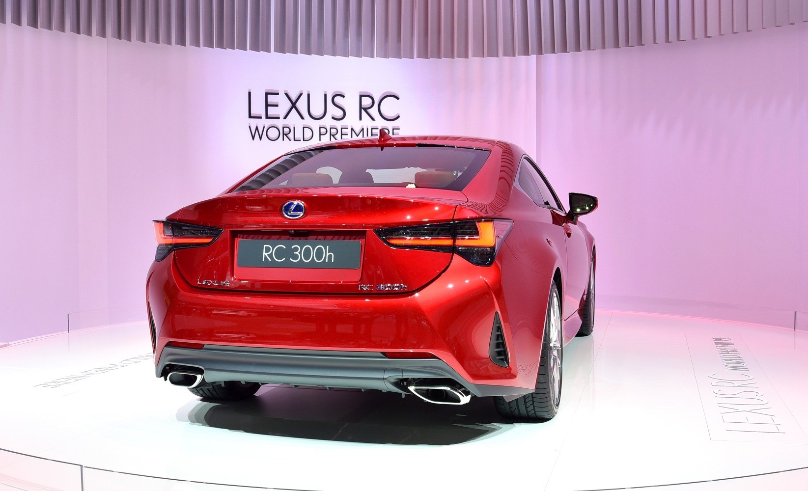 Rear view of a modern coupe with sleek taillights and dual exhausts