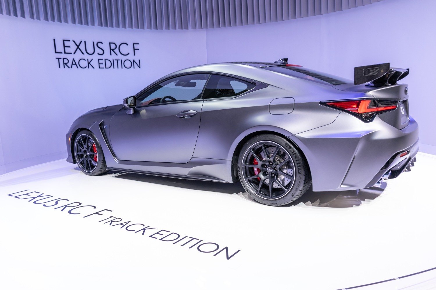 High-performance coupe with aerodynamic rear wing and sport wheels