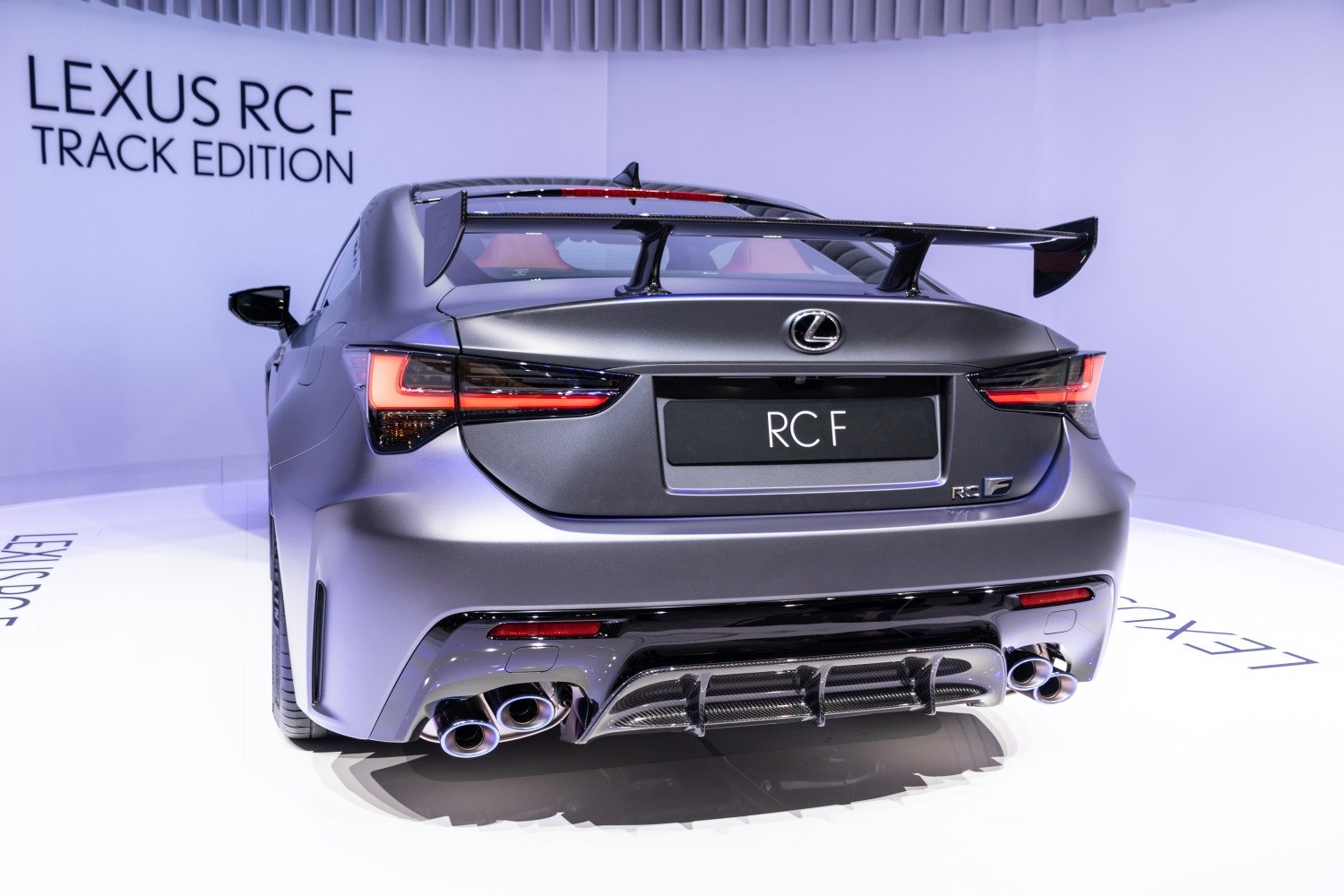 Rear view with carbon fiber spoiler and quad exhaust