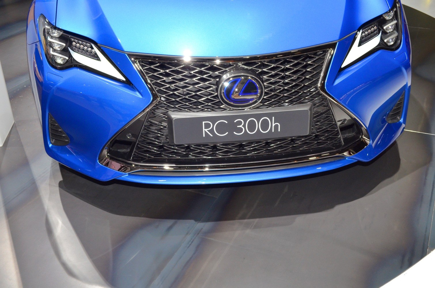 Close-up of front grille and LED headlights with signature spindle grille design