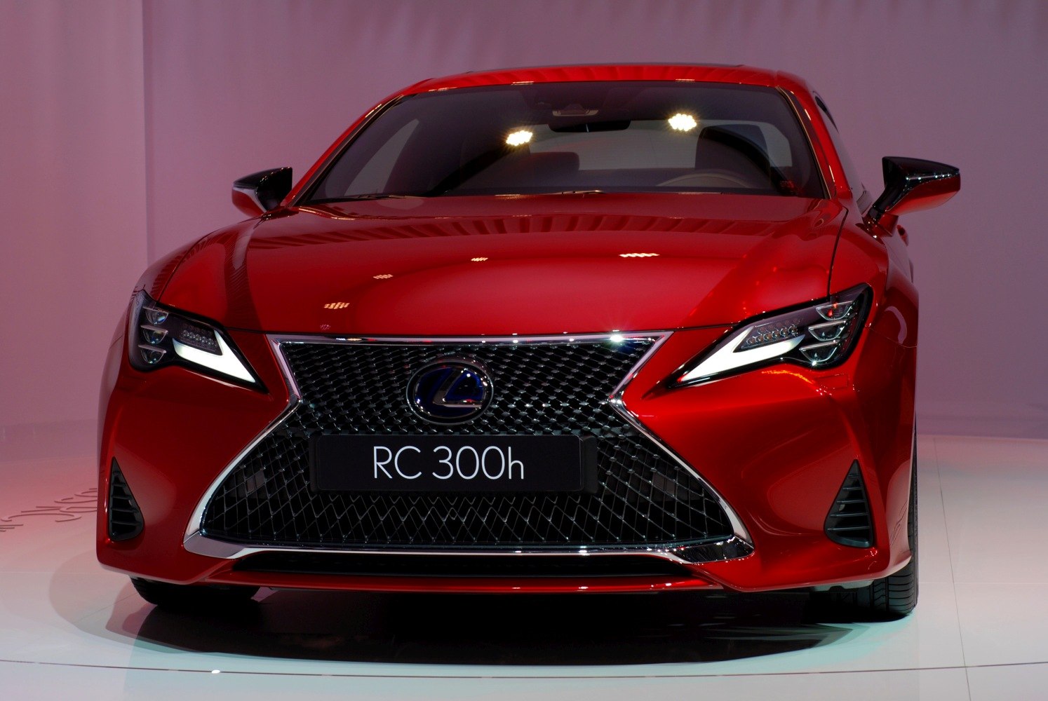 Front view with signature grille and sharp headlights