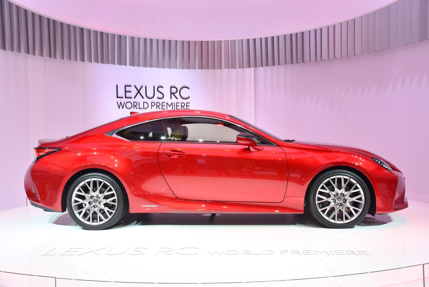 Red sleek sports coupe side profile with alloy wheels