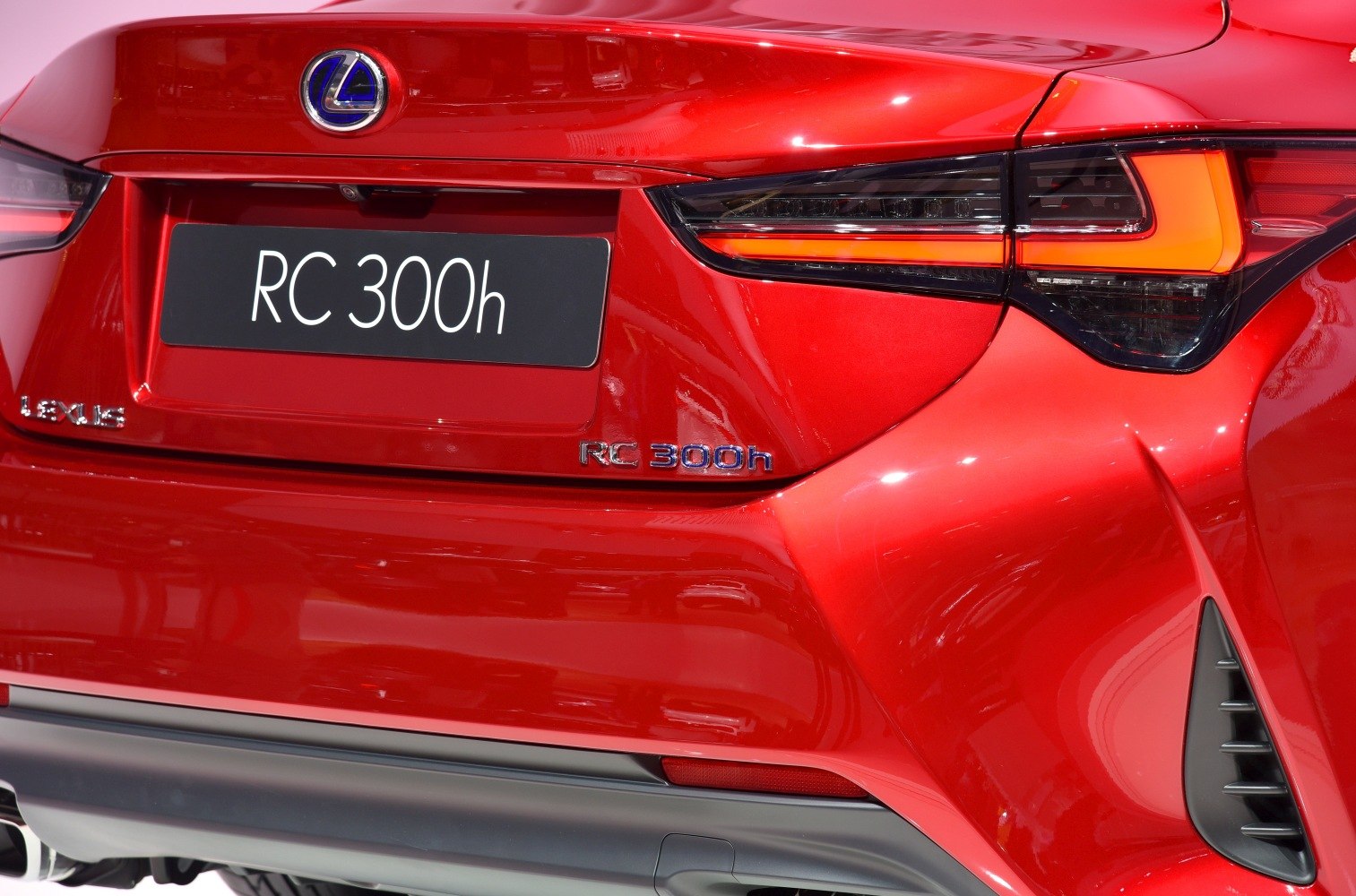 Rear design with hybrid badge and detailed tail light.