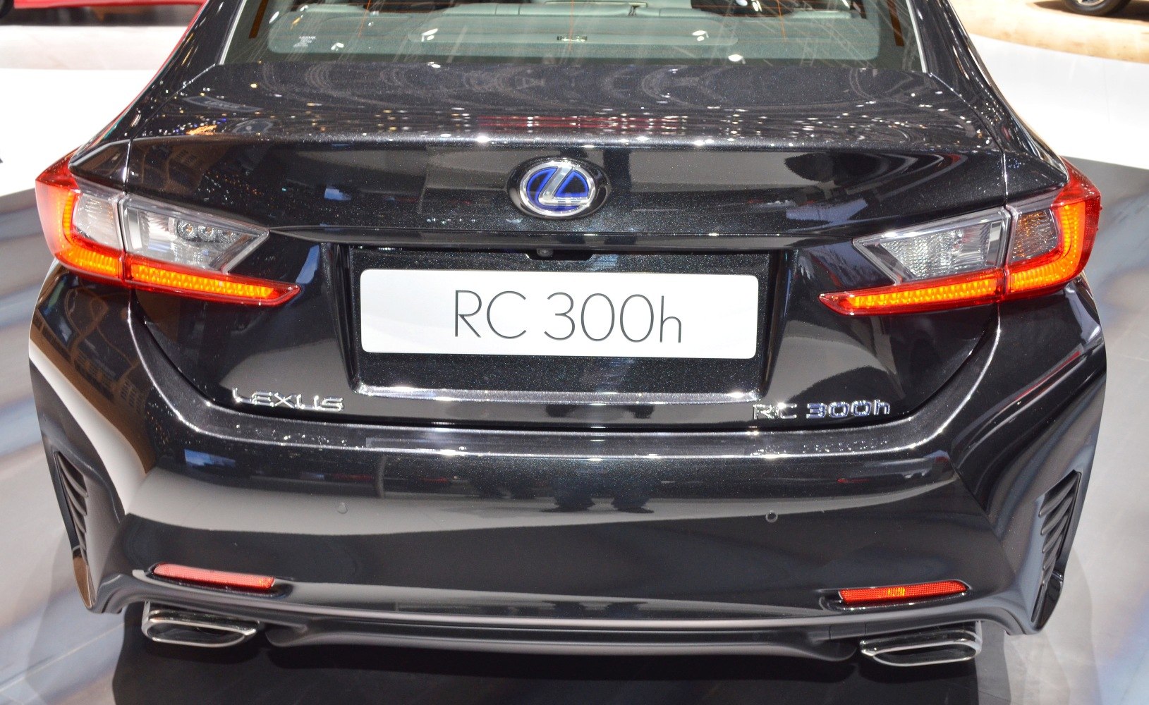 LED tail lights and dual exhausts on a sleek black rear end