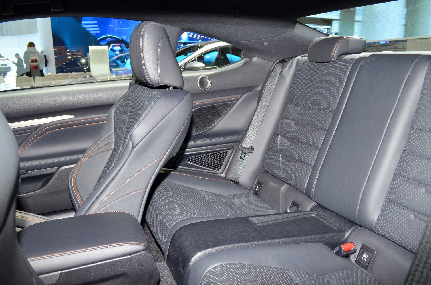 Black leather rear seats with detailed stitching and integrated seatbelts