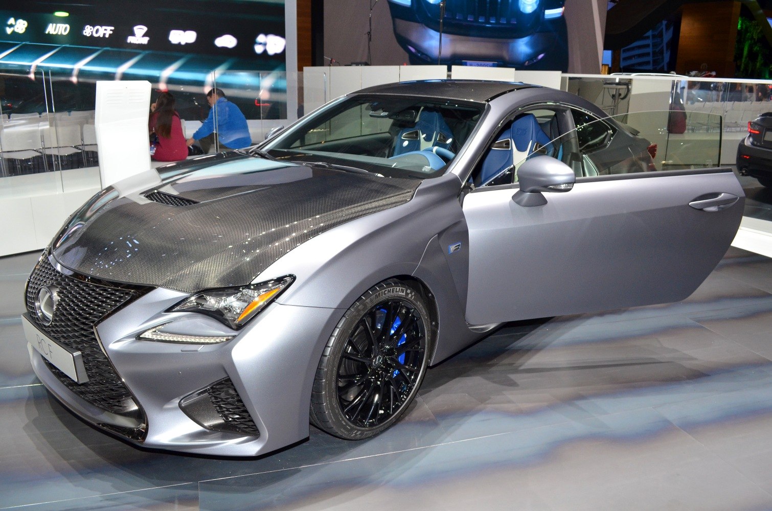 Carbon fiber hood and black sport wheels with blue interior accents