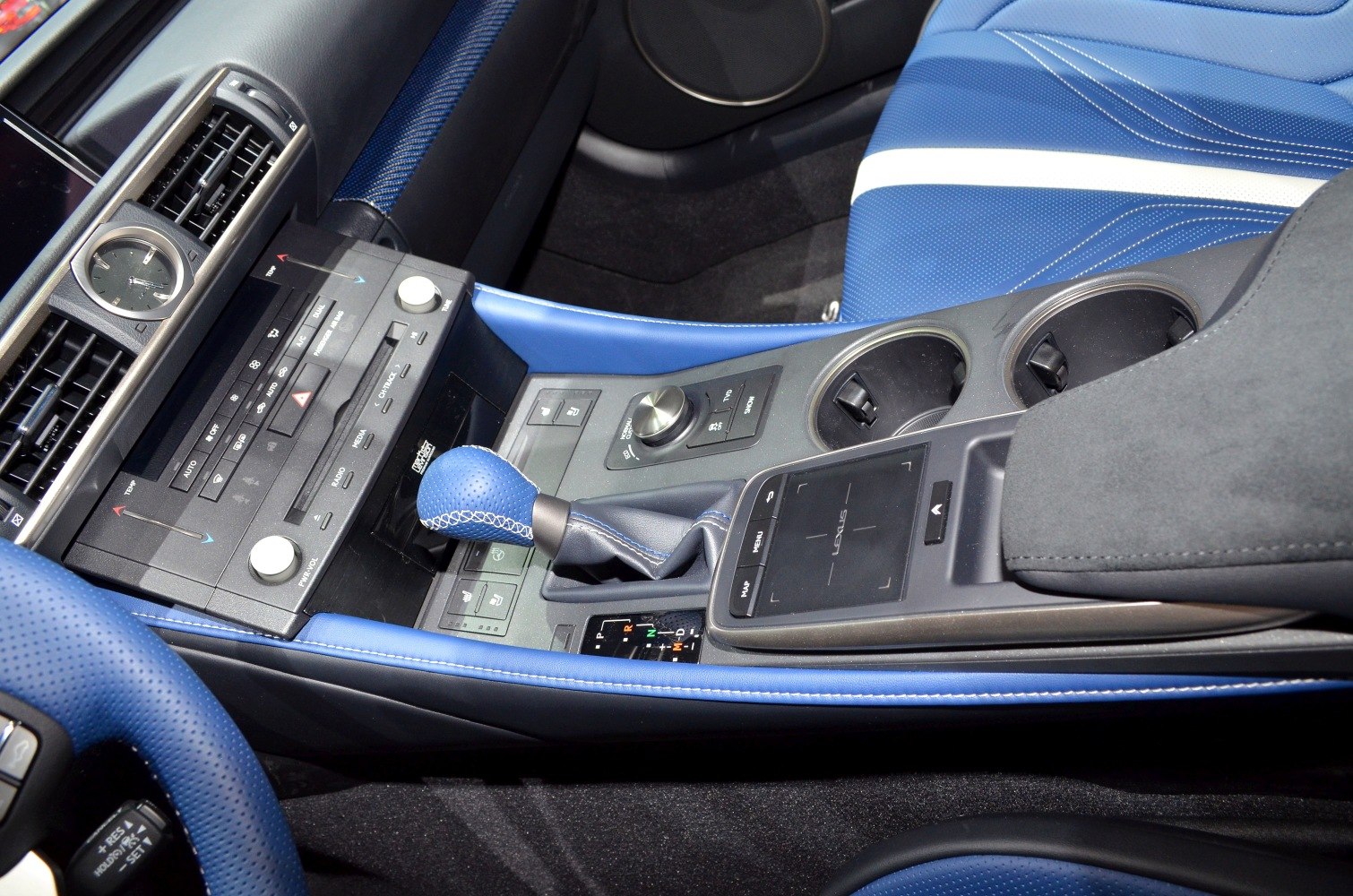 Blue leather interior with center console controls and gear shift.