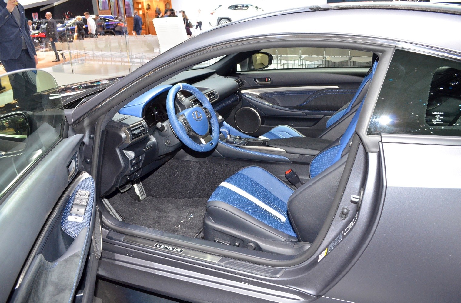 Sporty blue interior with detailed dashboard and steering wheel