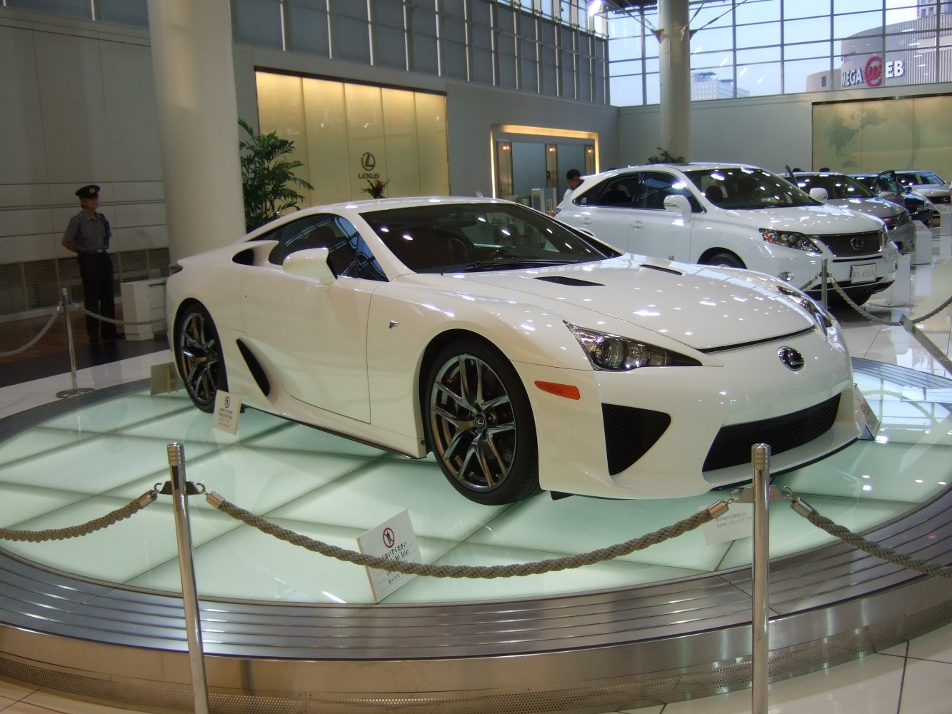 White sports coupe with aerodynamic vents and alloy wheels