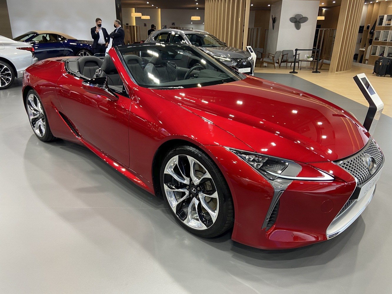Red convertible with distinctive front grille and LED headlights
