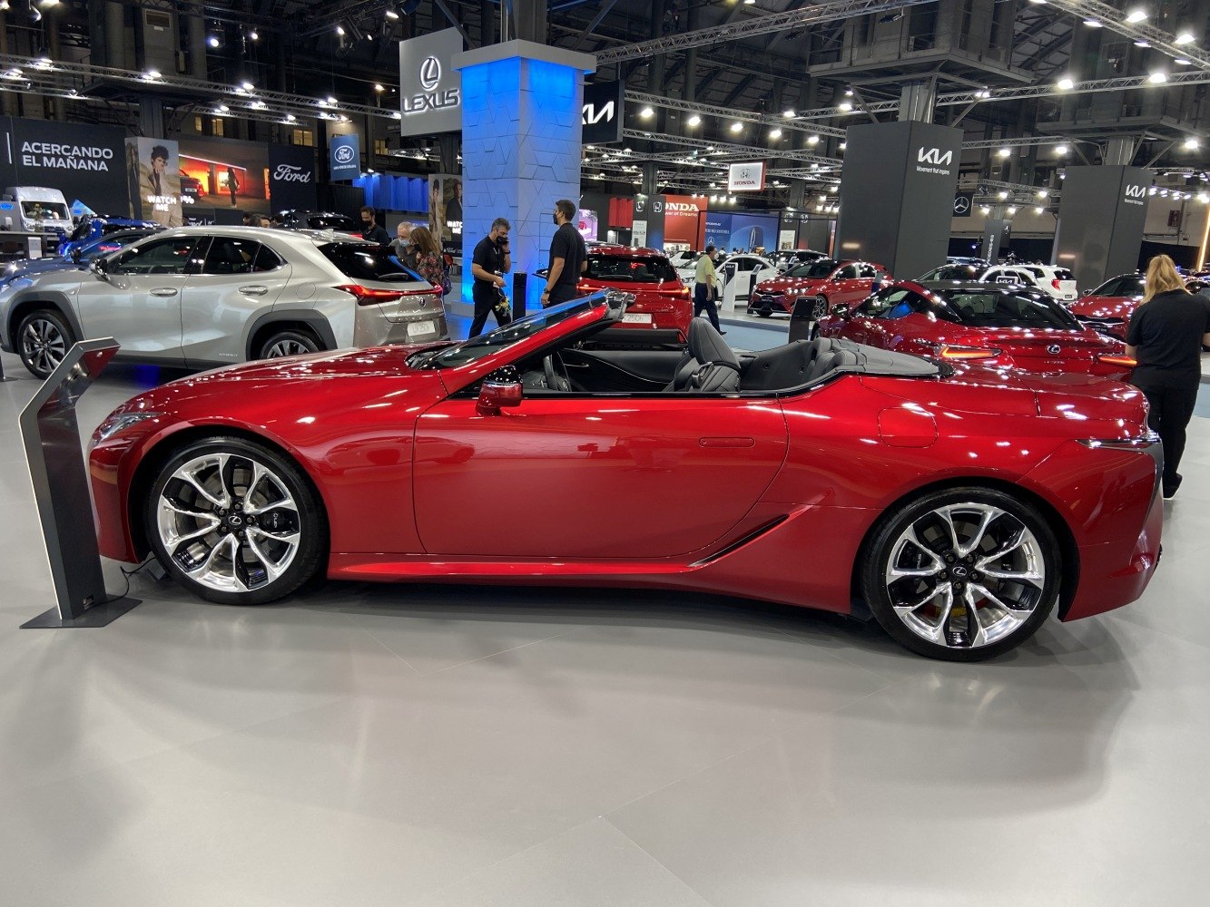 Red sporty luxury convertible with chrome rims side profile