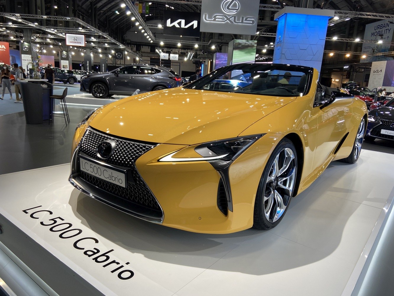 Close-up front view of sleek convertible with distinctive grille and LED headlights