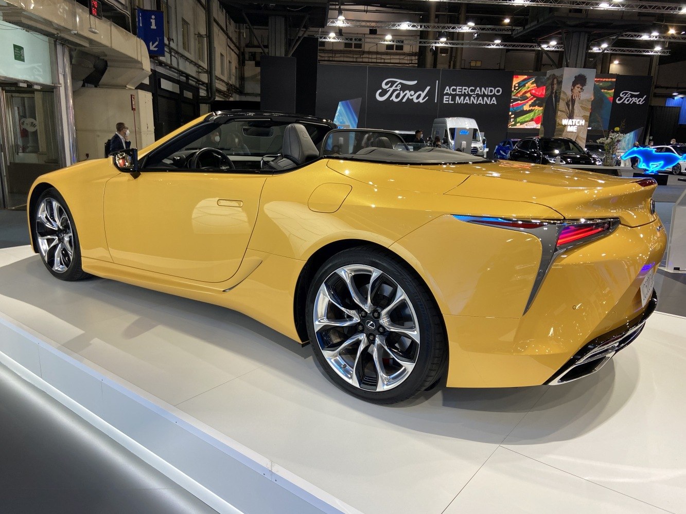 Yellow convertible with chrome wheels and sleek rear design
