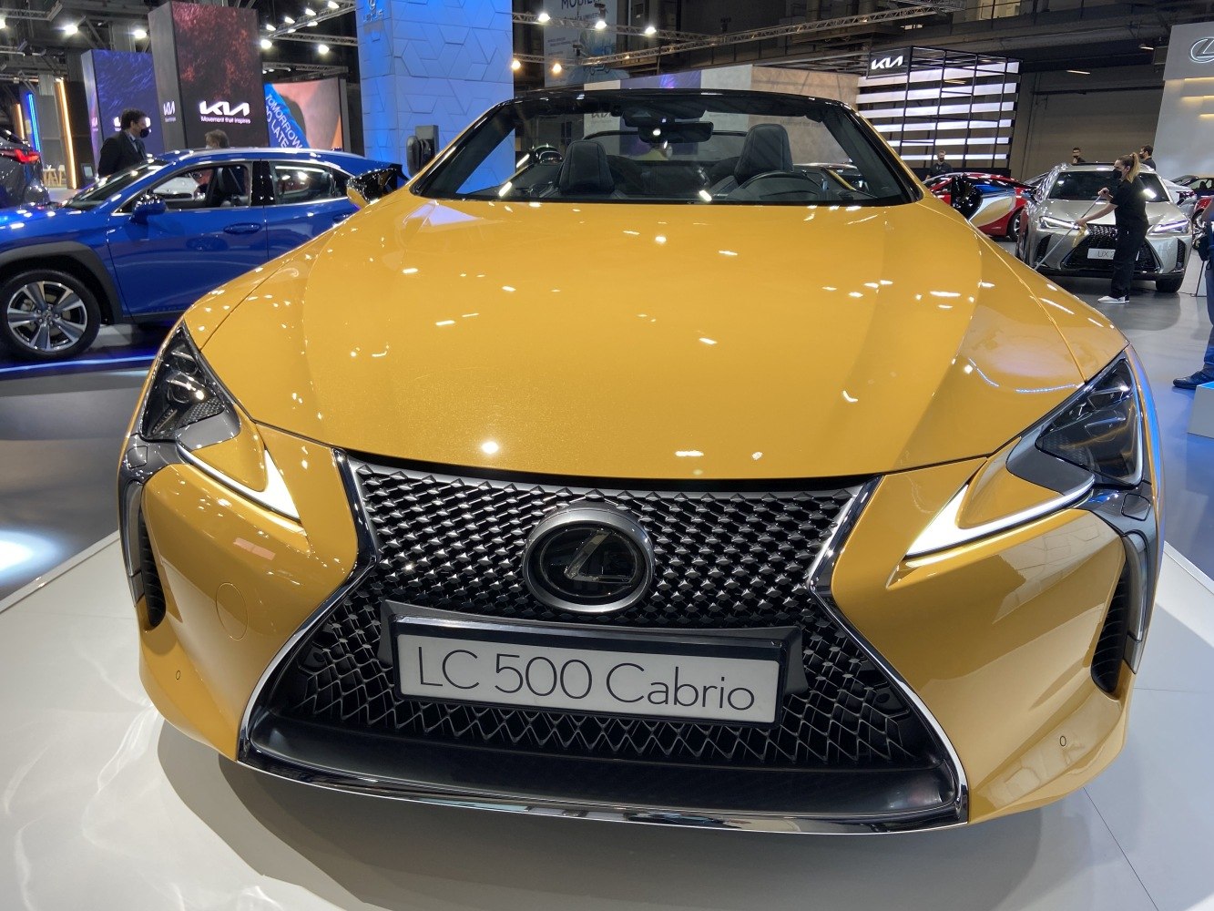 Aggressive front grille and LED headlights of a yellow convertible