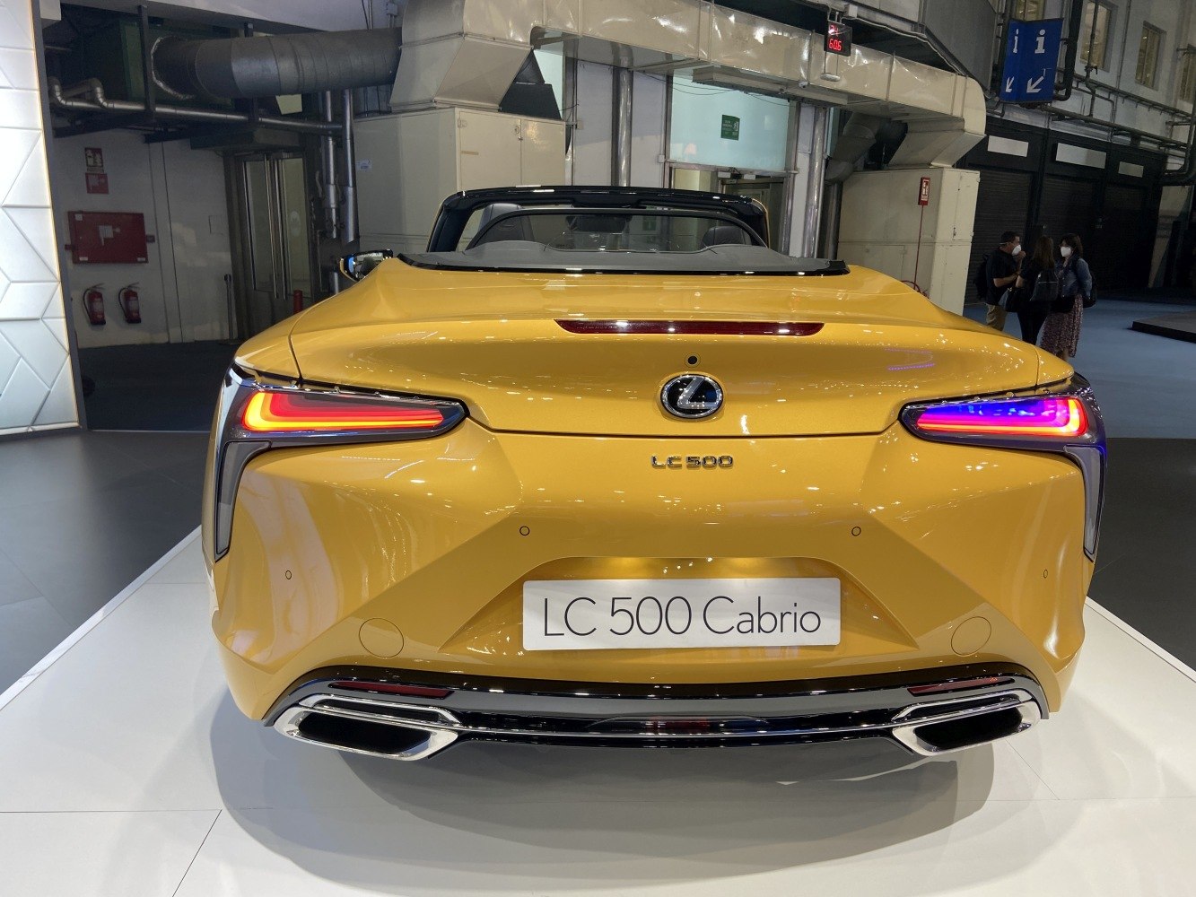 Rear view of a convertible with distinctive LED taillights and dual exhaust pipes